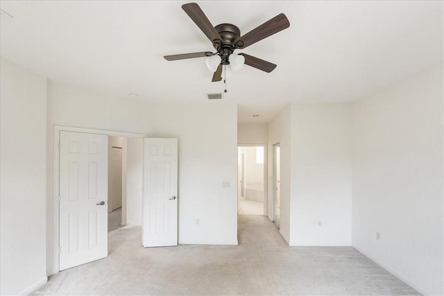2597 Stockbridge Sq SW Unit 2597, Vero Beach, FL 32962 - unfurnished bedroom with light colored carpet, ensuite bath, and a ceiling fan