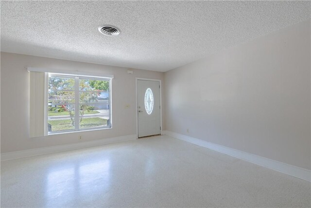 1936 5th Ave, Vero Beach, FL 32960 - foyer entrance with a textured ceiling