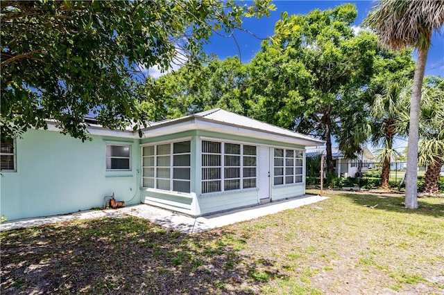1936 5th Ave, Vero Beach, FL 32960 - view of home's exterior with a yard