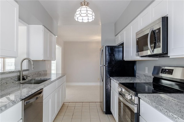 1936 5th Ave, Vero Beach, FL 32960 - kitchen with stainless steel appliances and white cabinets