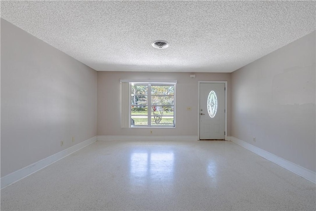 1936 5th Ave, Vero Beach, FL 32960 - foyer featuring a textured ceiling