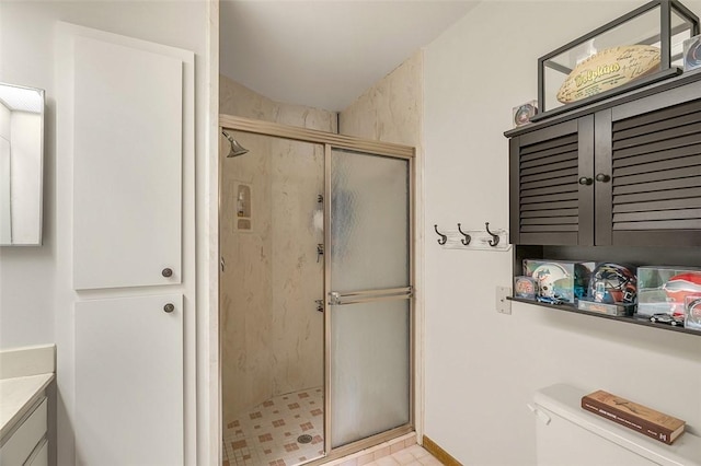 bathroom featuring vanity, toilet, and walk in shower