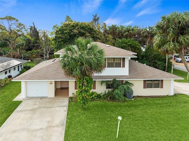 view of front of property featuring a garage and a front yard