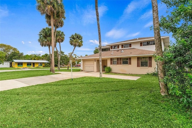 view of front of property featuring a garage and a front yard