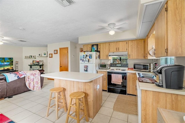 kitchen with white fridge, ceiling fan, electric range oven, and light tile patterned floors