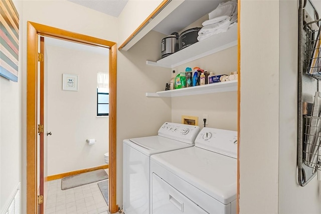 washroom featuring independent washer and dryer