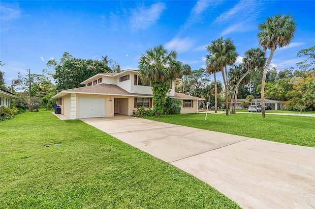 view of front of property featuring a garage and a front yard