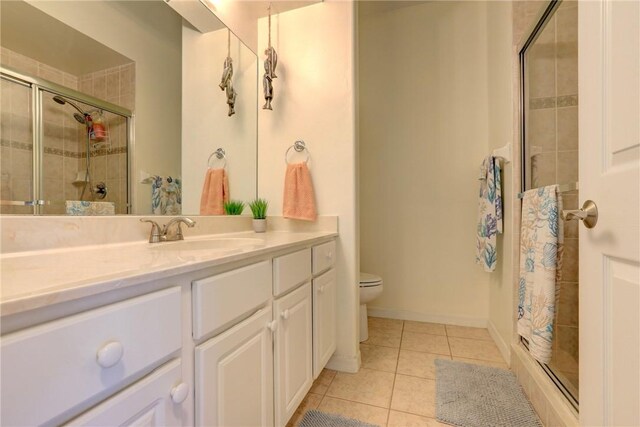537 Ray St, Sebastian, FL 32958 - bathroom with vanity, tile patterned flooring, a shower stall, and toilet