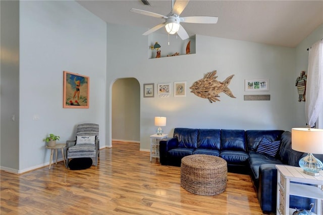 537 Ray St, Sebastian, FL 32958 - living room with arched walkways, ceiling fan, high vaulted ceiling, and wood finished floors