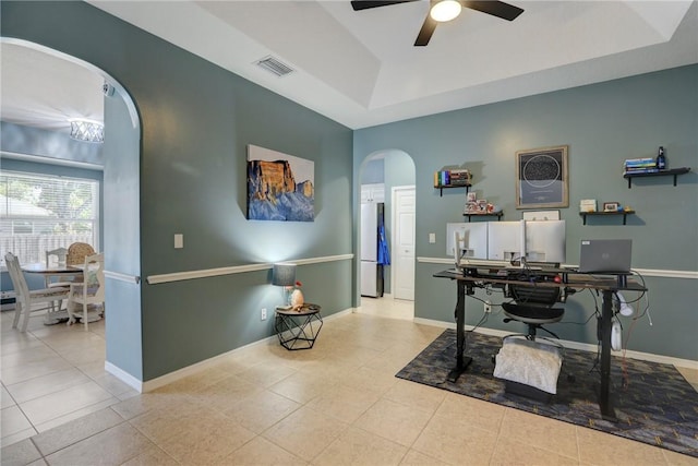 537 Ray St, Sebastian, FL 32958 - tiled office with visible vents, baseboards, ceiling fan, a raised ceiling, and arched walkways
