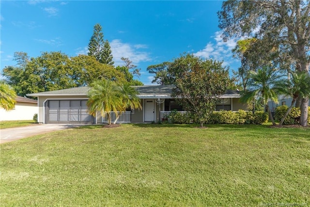 single story home featuring a garage and a front lawn