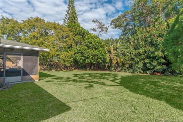 view of yard featuring a sunroom