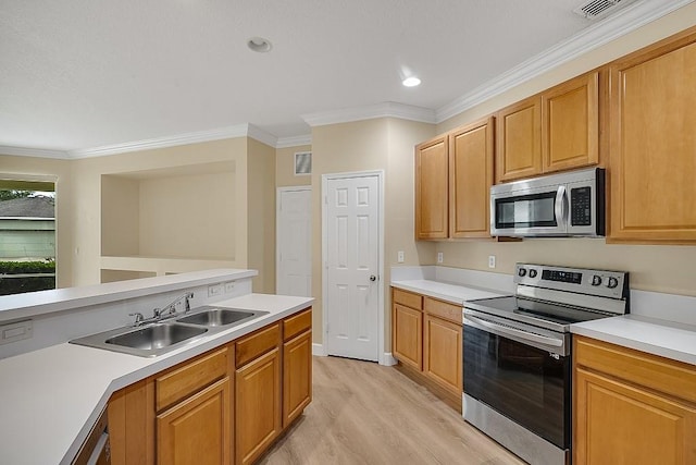 kitchen with ornamental molding, sink, stainless steel appliances, and light wood-type flooring