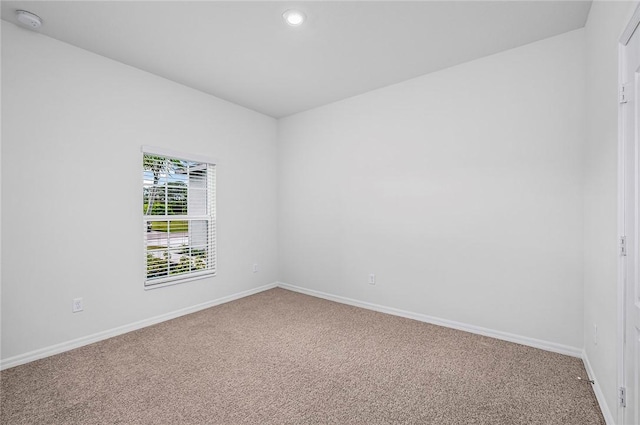 8425 98th Ct, Vero Beach, FL 32967 - empty room with carpet, baseboards, recessed lighting, and a smoke detector