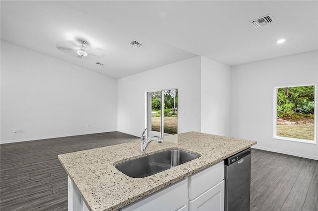 8425 98th Ct, Vero Beach, FL 32967 - kitchen with stainless steel dishwasher, a sink, dark wood-type flooring, white cabinets, and recessed lighting