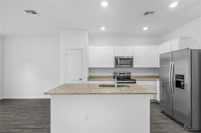 8425 98th Ct, Vero Beach, FL 32967 - kitchen featuring stainless steel appliances, a sink, dark wood-style flooring, white cabinetry, and baseboards