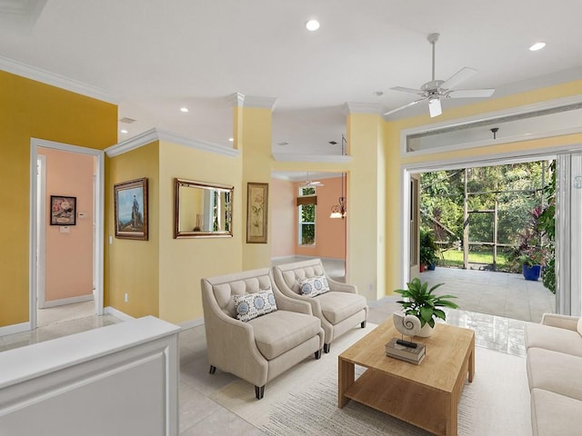 living room featuring ceiling fan, light tile patterned floors, and crown molding