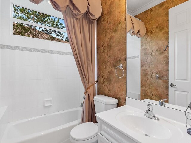 full bathroom with toilet, vanity, crown molding, and shower / bathtub combination with curtain