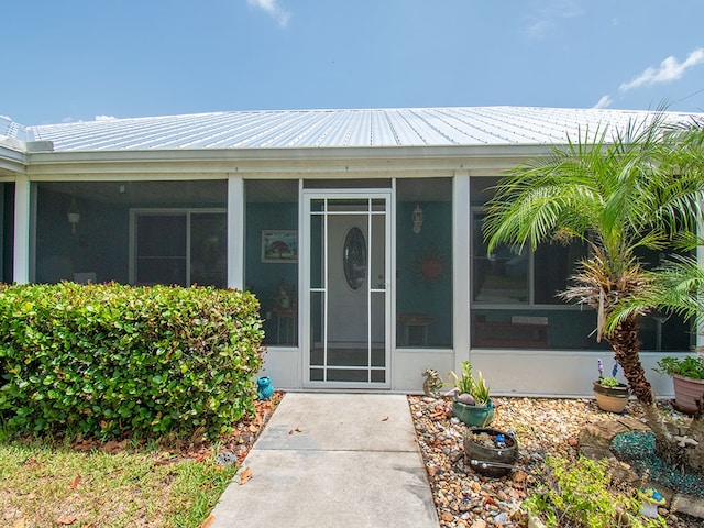 624 24th St SW, Vero Beach, FL 32962 - property entrance with a metal roof