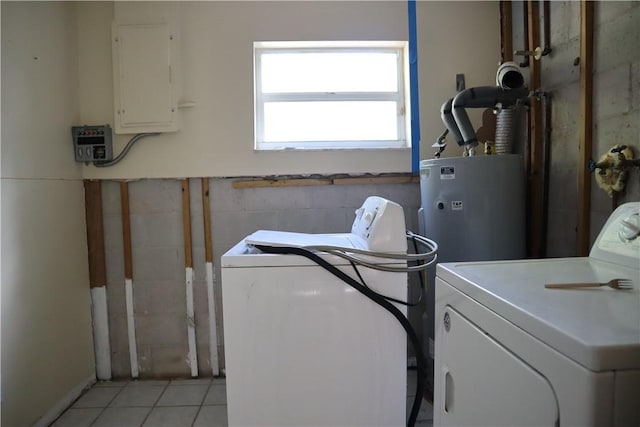 755 39th Ave, Vero Beach, FL 32968 - laundry area featuring washer and dryer, electric panel, light tile patterned floors, and water heater