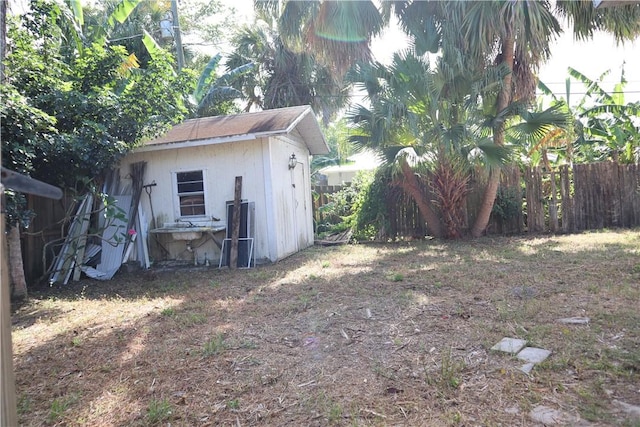 755 39th Ave, Vero Beach, FL 32968 - fenced backyard with an outdoor structure and a storage unit