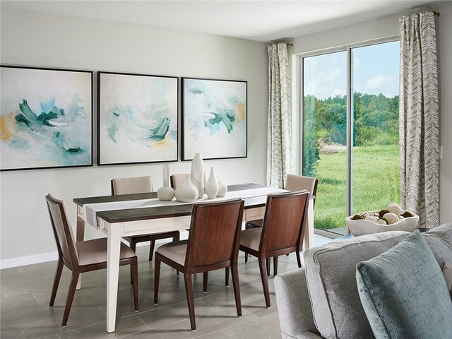 dining space with light tile patterned floors