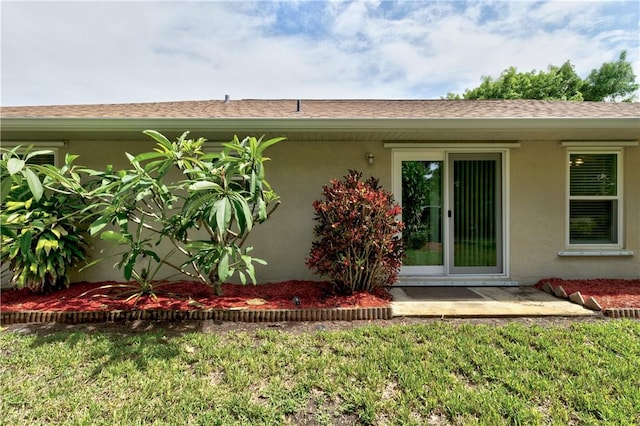 3405 Atlantic Blvd, Vero Beach, FL 32960 - rear view of house with stucco siding and roof with shingles