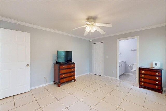 3405 Atlantic Blvd, Vero Beach, FL 32960 - unfurnished bedroom featuring crown molding, a closet, light tile patterned floors, a ceiling fan, and baseboards