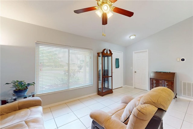 3405 Atlantic Blvd, Vero Beach, FL 32960 - living room with vaulted ceiling, light tile patterned flooring, ceiling fan, and baseboards