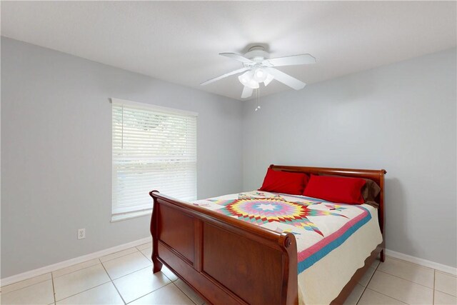 3405 Atlantic Blvd, Vero Beach, FL 32960 - bedroom with baseboards, light tile patterned flooring, and ceiling fan