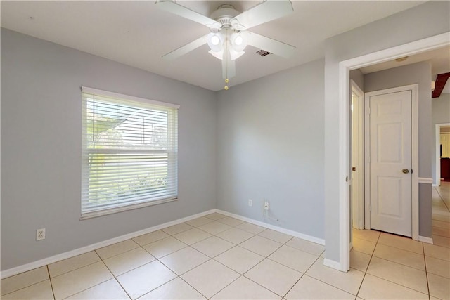 3405 Atlantic Blvd, Vero Beach, FL 32960 - unfurnished room with light tile patterned floors, a ceiling fan, and baseboards