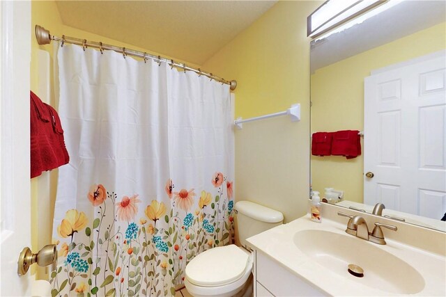 3405 Atlantic Blvd, Vero Beach, FL 32960 - bathroom featuring vanity, toilet, and curtained shower
