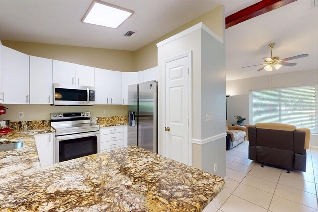 3405 Atlantic Blvd, Vero Beach, FL 32960 - kitchen with appliances with stainless steel finishes, vaulted ceiling, light stone counters, light tile patterned floors, and ceiling fan