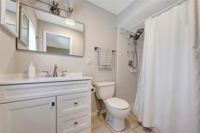 full bathroom with toilet, tile patterned flooring, tiled shower, and vanity