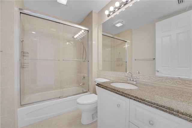 9 Harbour Isle Dr E Unit Ph01, Fort Pierce, FL 34949 - full bathroom featuring vanity, toilet, shower / bath combination with glass door, and tile patterned floors