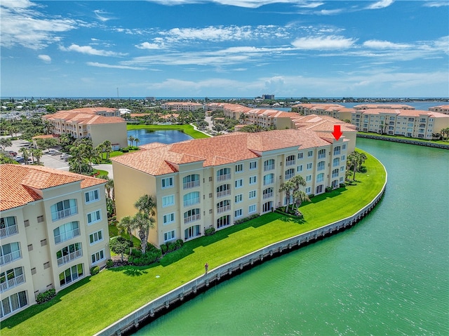 birds eye view of property featuring a water view