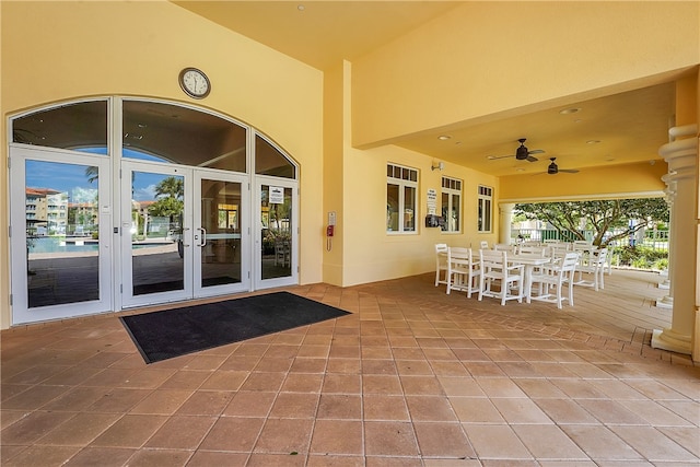 view of patio / terrace featuring ceiling fan and french doors