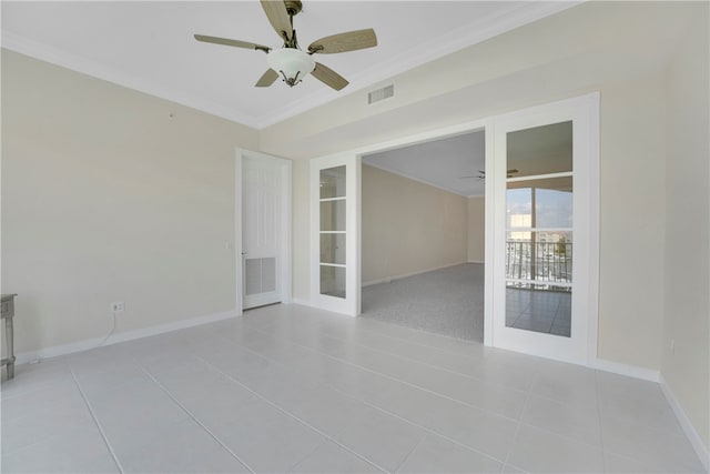 spare room featuring french doors, ceiling fan, light tile patterned floors, and crown molding