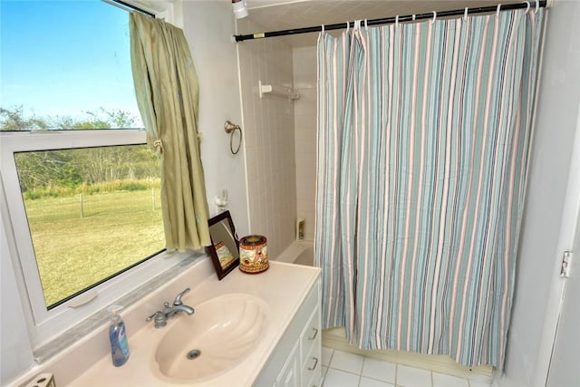 bathroom with tile patterned flooring, vanity, and shower / tub combo