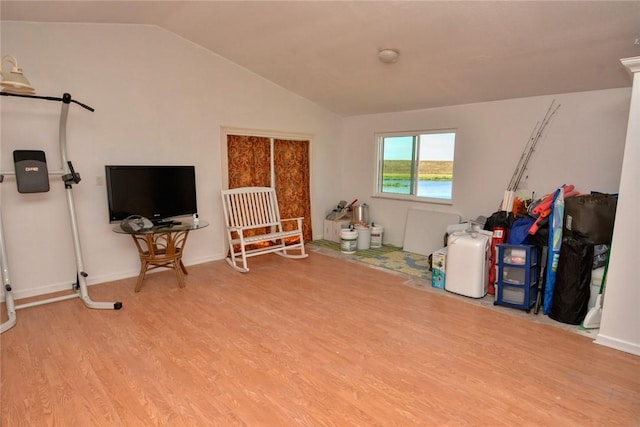 misc room featuring light hardwood / wood-style floors and lofted ceiling