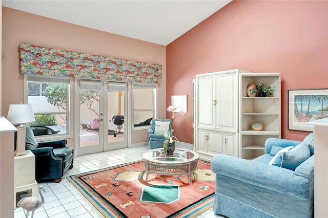 202 N Carmel Ct, Vero Beach, FL 32963 - sitting room with light tile patterned floors, lofted ceiling, and french doors