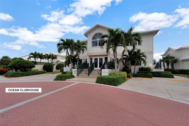 202 N Carmel Ct, Vero Beach, FL 32963 - view of front of home featuring stucco siding and stairs