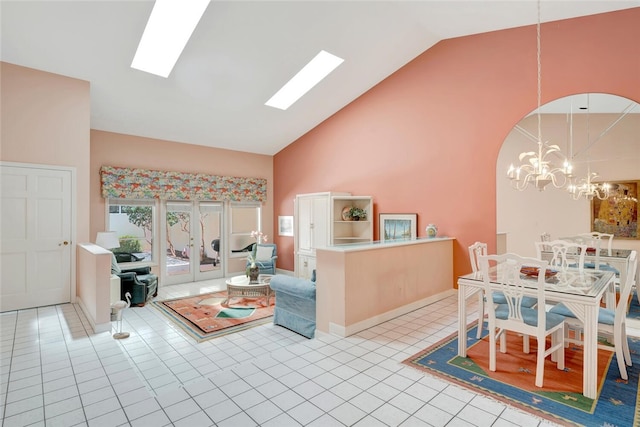 202 N Carmel Ct, Vero Beach, FL 32963 - living room featuring a chandelier, high vaulted ceiling, arched walkways, and light tile patterned floors