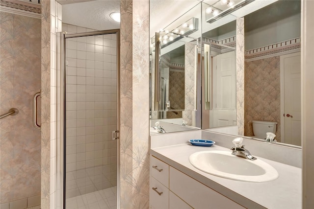 202 N Carmel Ct, Vero Beach, FL 32963 - full bathroom with toilet, vanity, a shower stall, and wallpapered walls