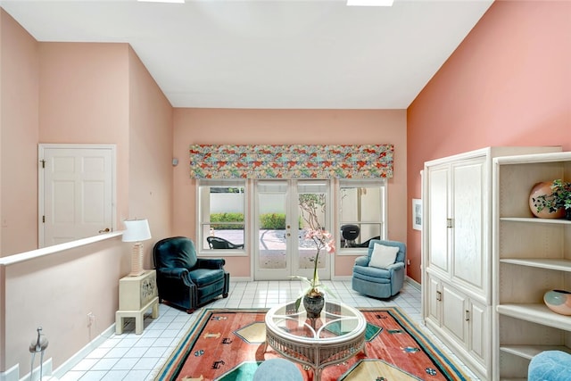 202 N Carmel Ct, Vero Beach, FL 32963 - living area with baseboards, light tile patterned floors, and french doors