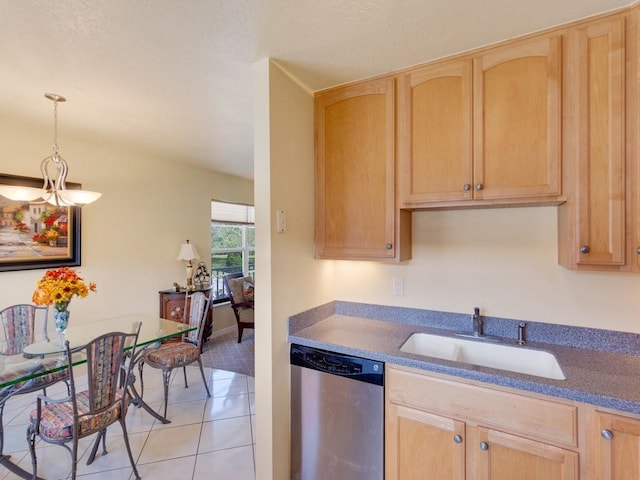 kitchen featuring sink, light tile patterned floors, dishwasher, hanging light fixtures, and light brown cabinetry