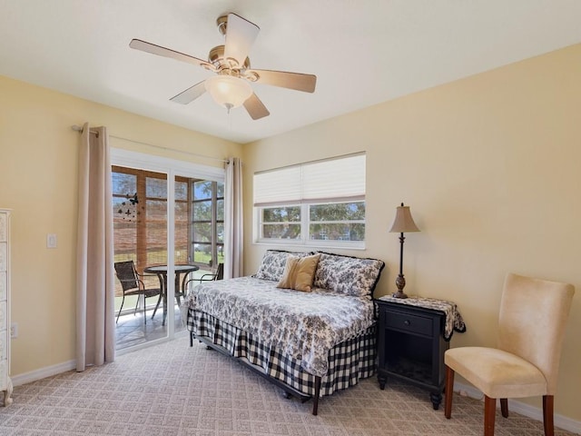 bedroom with ceiling fan, light carpet, and access to outside