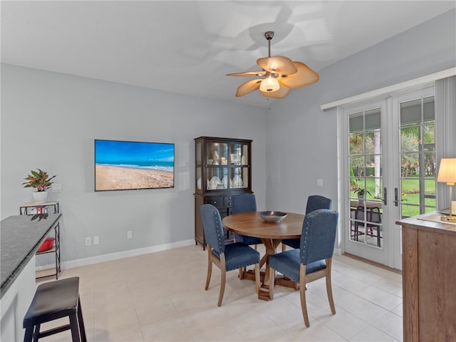 dining space featuring ceiling fan and light tile patterned flooring