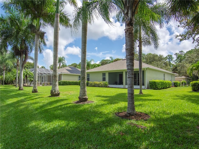 view of yard with a lanai