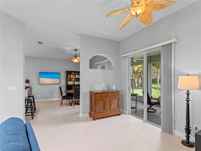 interior space featuring light tile patterned flooring and ceiling fan